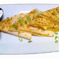 Quesadillas · SERVED WITH SOUR CREAM AND SALSA