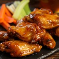 Traditional Hot Honey  Wings · 8 pieces of wings drenched in hot honey glaze (medium heat), served with carrots & celery an...