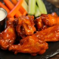 Traditional Classic Wings · 8 classic buffalo sauce wings (medium heat), served with carrots & celery and a choice of bl...