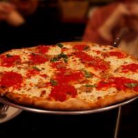 Coal Traditional Margherita Pizza (Lg.) · The finest fresh plum tomatoes, fresh mozzarella, romano cheese, basil, and virgin olive oil.
