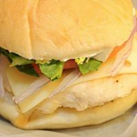 Grilled Chicken Sandwich · A grilled chicken breast served with lettuce, tomato, onion and your choice of cheese on a k...