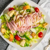 Julienne · Ham, turkey, swiss, tomatoes, onions, cucumbers, croutons, and green peppers over a bed of l...