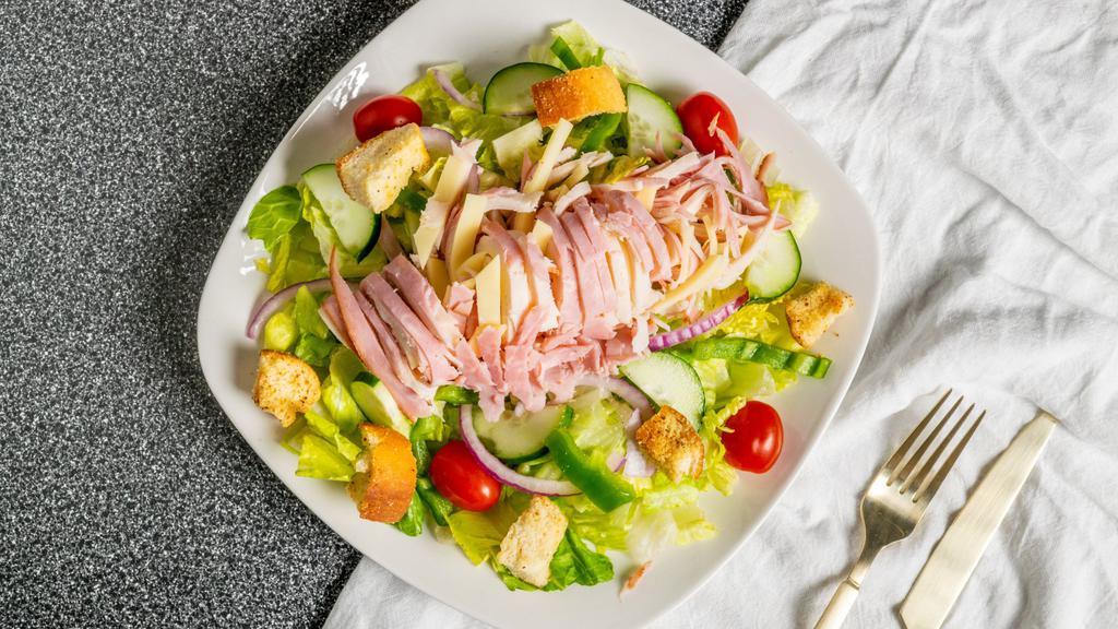 Julienne · Ham, turkey, swiss, tomatoes, onions, cucumbers, croutons, and green peppers over a bed of lettuce with your choice of dressing.