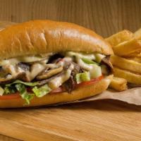 Combo Philly Cheesesteak · Delicious juicy steak and chicken with cheese, caramelized onions, green peppers, black pepp...