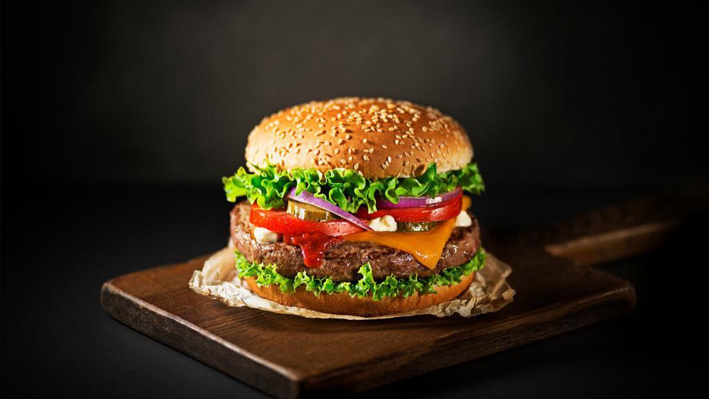 Beef Burger · Delicious ground beef patty with lettuce, tomatoes, onions, and jalapeños.