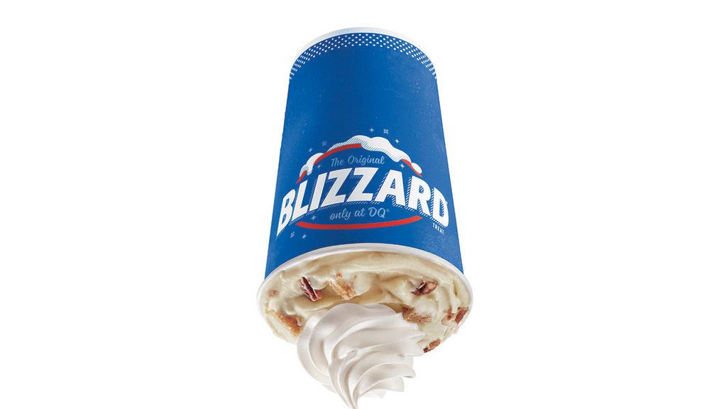 Pecan Pie Blizzard® Treat · Brown sugar pie pieces, pecans and caramel topping blended with our world-famous soft serve to Blizzard® Perfection and garnished with whipped topping.