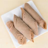 Extra Injera · Sour dough thin flat bread (two rolls per order)