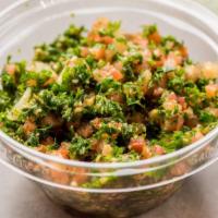 Taboule Salad · Vegetarian, Vegan. Fresh parsley, wheat bulgur, tomatoes, onions, lemon juice, and olive oil.