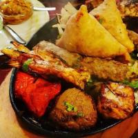 Kashmiri Combination Platter · Brown rice w/ Chicken Kabab, Chicken tikka, Shaami kabab, lamb chops, & nan bread.

Served w...
