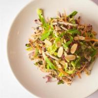 Charred Brussel Sprout Salad (Gf,V) · with warm mint, scallions, bean sprouts, radicchio, carrots, toasted almond, and lime shallo...