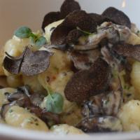 Wild Mushroom Gnocchi · light cream sauce, sautéed wild mushrooms, shaved perigord truffles