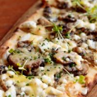 Wild Mushroom & Truffle Flatbread · Sautéed wild mushrooms, goats cheese, a flatbread topped with truffle oil and chives.