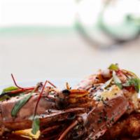Shrimp Toast · Whole shrimp sautéed in chili and garlic on sourdough toast.