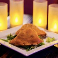 Chicken / Veggie Samosa (2Pc) · Traditional turnover filled with a mix of chicken or
veggie exotic spices.