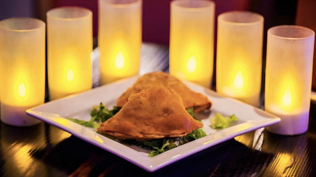 Chicken / Veggie Samosa (2Pc) · Traditional turnover filled with a mix of chicken or
veggie exotic spices.