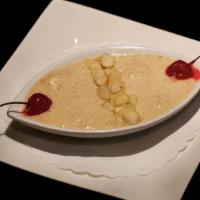 Kheer · Cooled rice pudding, flavored with cardamom.