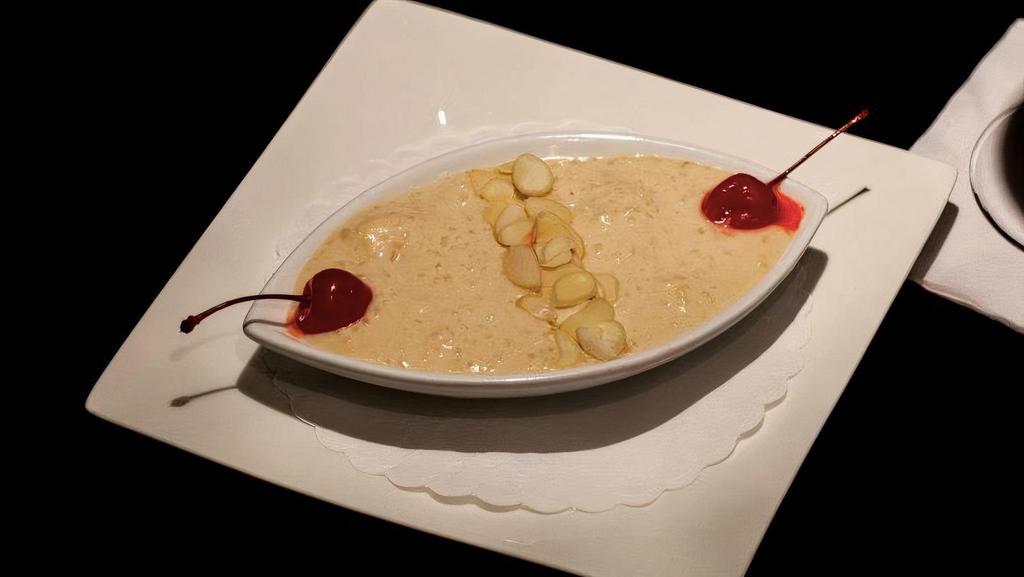 Kheer · Cooled rice pudding, flavored with cardamom.