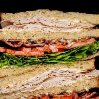 Turkey Club · Home Roast Turkey • Bacon • Lettuce • Tomato • Mayo • Triple Decker White Toast