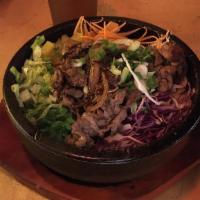 Sesame Leaf Bulgogi Bibimbap Stone Bowl · Marinated rib eye and chef's choice of seasonal vegetables on top of rice.