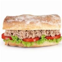 Tuna Sandwich · Delicious Sandwich made with Tuna, lettuce, tomato, onion and mayo on a baguette. Served wit...