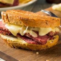 Reuben Sub · Juicy corned beef, swiss cheese, grilled onion, peppers & mayo.