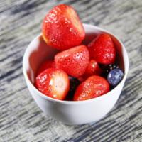 Fresh Fruit Salad · Melon cantaloupe strawberries and blueberries.
