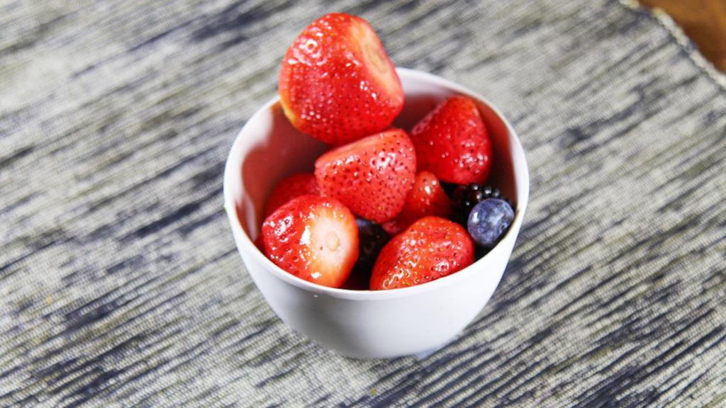 Fresh Fruit Salad · Melon cantaloupe strawberries and blueberries.