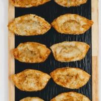 Oko Mandu(오코만두) · Fried dumplings with bonito and okonomi sauce.
