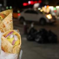 Egg Chicken Kati Roll · Flatbread layered with freshly beaten egg and Chicken Tikka filling.