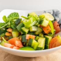 Kachumber Salad · Sweet-tangy tomatoes, crunchy cucumbers and piquant onions.