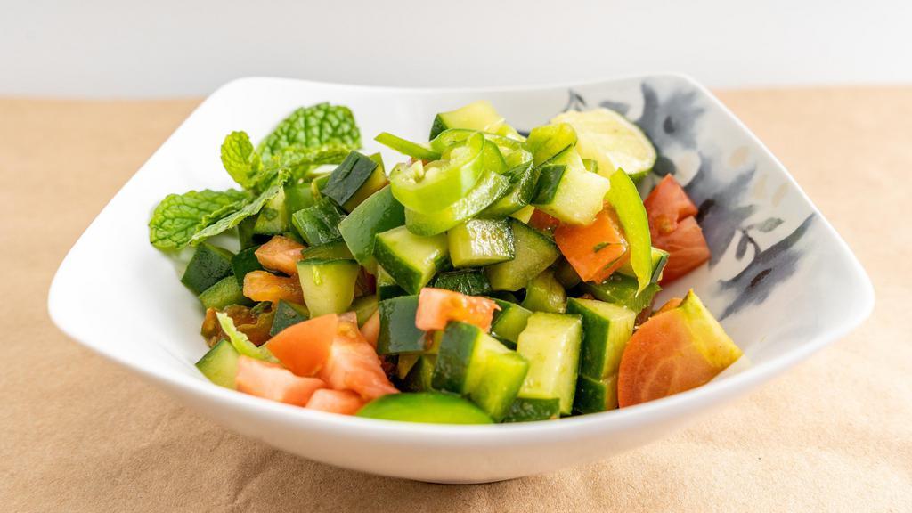 Kachumber Salad · Sweet-tangy tomatoes, crunchy cucumbers and piquant onions.