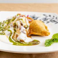 Samosa Chaat · Crispy samosa topped with chickpeas masala, yoghurt, tamarind date, cool mind and coriander ...