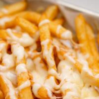 Cheesy Fries · Hand Cut Fries smothered with jalapeno cheese sauce.