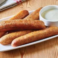 Breadsticks With Alfredo Sauce · Five golden brown signature breadsticks brushed with buttery garlic and parsley. Served with...