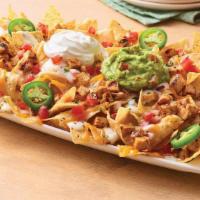 Neighborhood Nachos Chipotle Lime Chicken · Freshly made white corn tortilla chips are topped with grilled chicken, queso blanco, a blen...