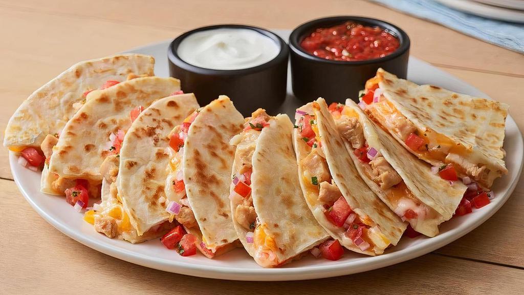 Chicken Quesadilla · Warm, grilled tortillas are loaded with chipotle lime chicken, house-made pico de gallo and a blend of melted Cheddar cheeses. Served with our chipotle lime salsa and sour cream.