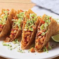 Grilled Chicken Wonton Tacos · Sweet Asian chile marinated grilled chicken stuffed into crispy wonton shells topped with ou...