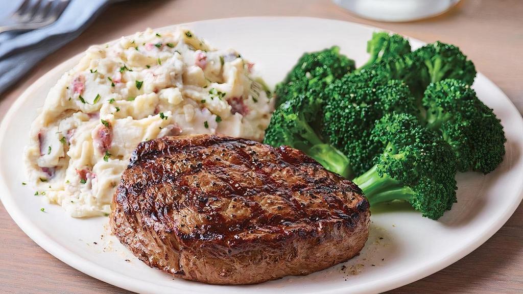 6 Oz. Top Sirloin* · Lightly seasoned USDA Select top sirloin* cooked to perfection and served hot off the grill.  Served with garlic mashed potatoes and steamed broccoli.