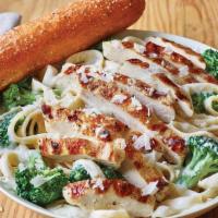 Classic Broccoli Chicken Alfredo · A neighborhood favorite. Juicy grilled chicken is served warm on a bed of fettuccine pasta t...