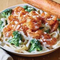 Classic Blackened Shrimp Alfredo · Blackened Shrimp is served warm on a bed of fettuccine pasta tossed with broccoli and rich A...