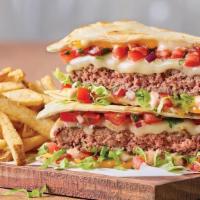 Quesadilla Burger · Part burger, part quesadilla, all taste. This original burger creation comes piled high with...