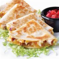 Kids Chicken Quesadilla · A flour tortilla filled with chicken and ooey, gooey melted Cheddar cheese. Served with lett...