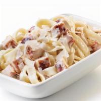 Kids Grilled Chicken Alfredo · Oodles of noodles covered with a creamy Alfredo sauce, then tossed with diced chicken and sp...