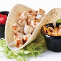 Kids Chicken Taco · A soft flour tortilla shell filled with chopped chicken and Cheddar cheese. Served with lett...