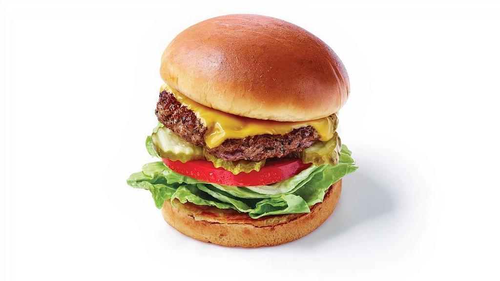Kids Cheeseburger · Ground beef burger served on a toasted bun with American cheese, lettuce, tomato and pickles .