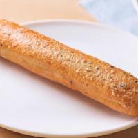 Add Breadstick (1) · Our golden brown signature breadstick brushed with buttery garlic and parsley.
