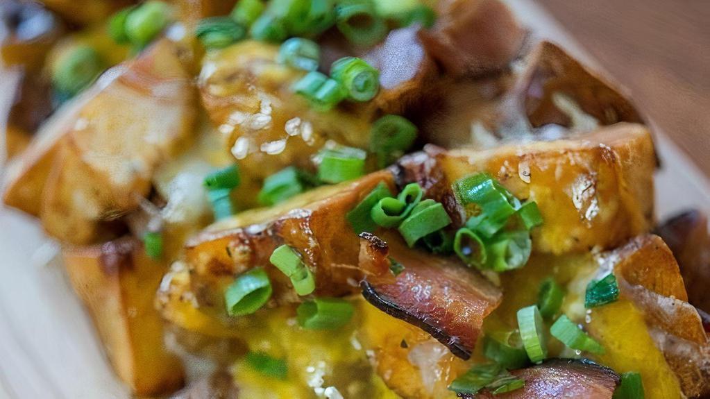 Loaded Potatoes · Cheddar, applewood smoked bacon, sour cream