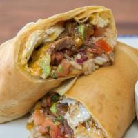 Short Rib Breakfast Burrito · Five-hour braised short rib, over easy eggs, avocado, cheddar, tomato basil pico, cilantro r...