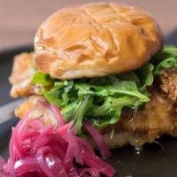 Fried Chicken Sammy · Two chicken cutlets tossed in apricot bourbon hot honey with Swiss, pickled onion, arugula a...