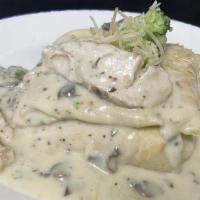 Chicken Tarragon Crepe · Grilled chicken, broccoli & mushrooms in a tarragon cream sauce with aged parmesan